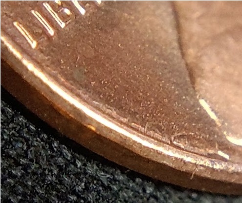 1983-P-Lincoln-Cent-With-A-Secondary,-Incuse-&-Inverted,-Trust-In-The-Corner-Of-The-Rim-And-Field.